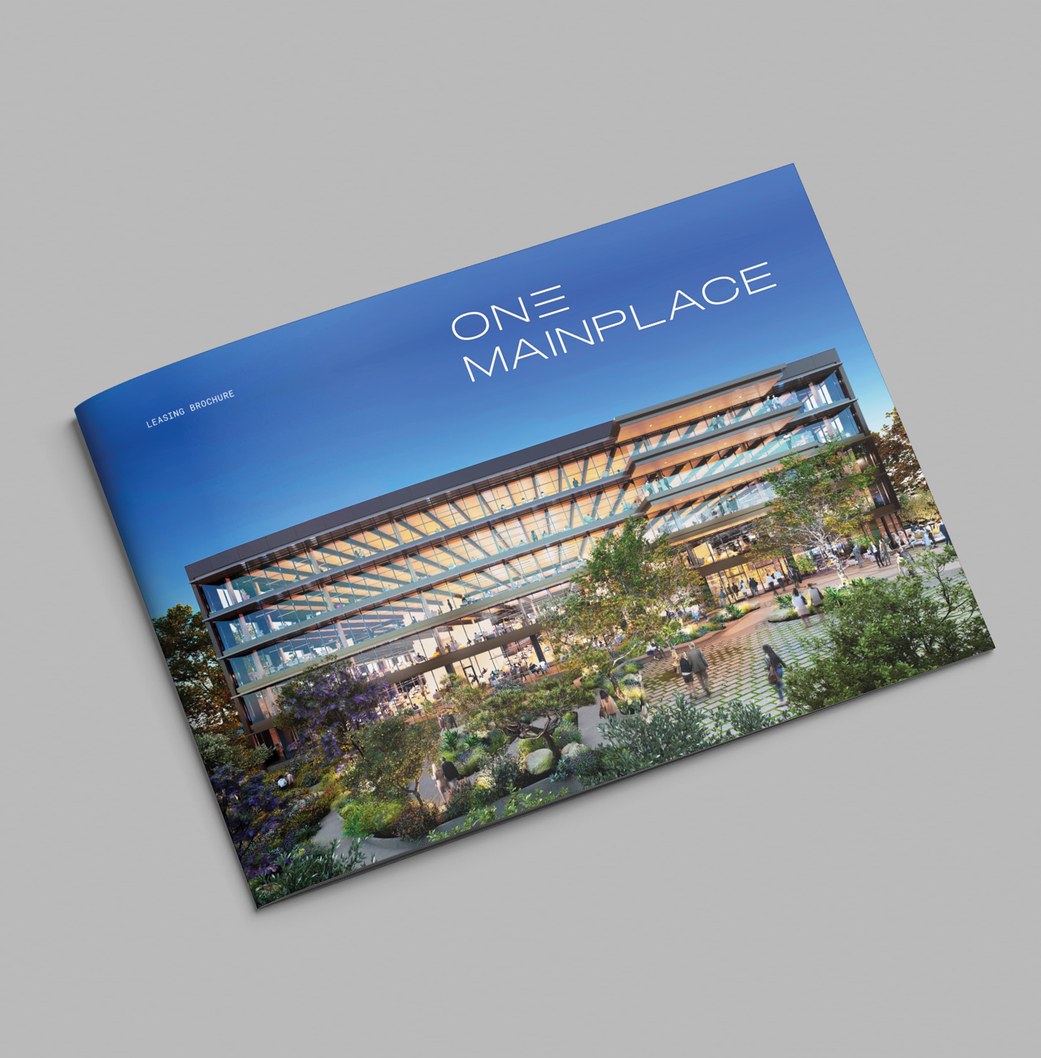 One MainPlace workplace leasing brochure cover with rendering of the building and logo in top right corner on grey background