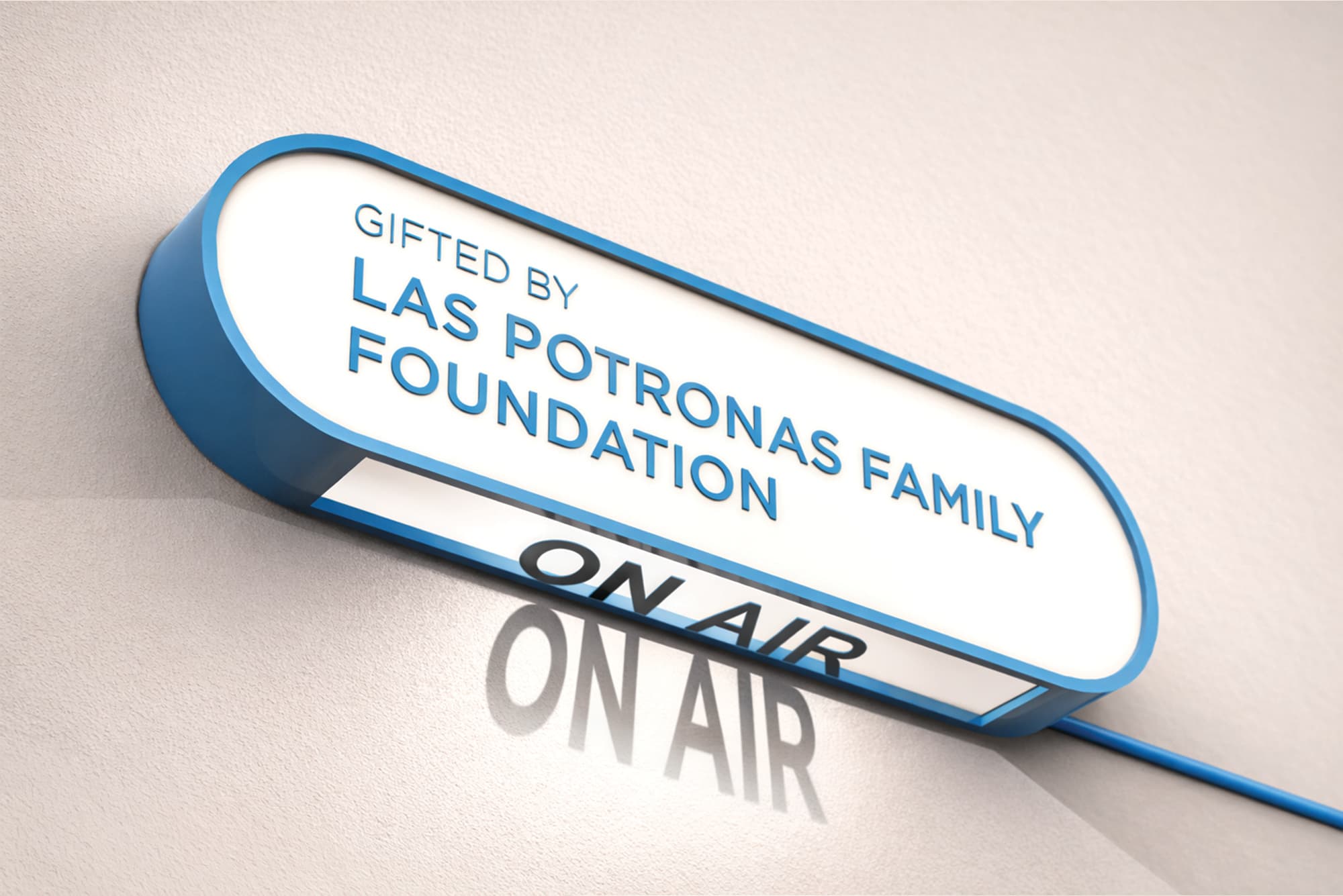 Branded donor recognition signage integrated with illuminated “On Air” indicator, showcasing environmental graphic design, experiential storytelling, and identity-driven signage by RSM Design within a media, broadcast, and cultural environment.
