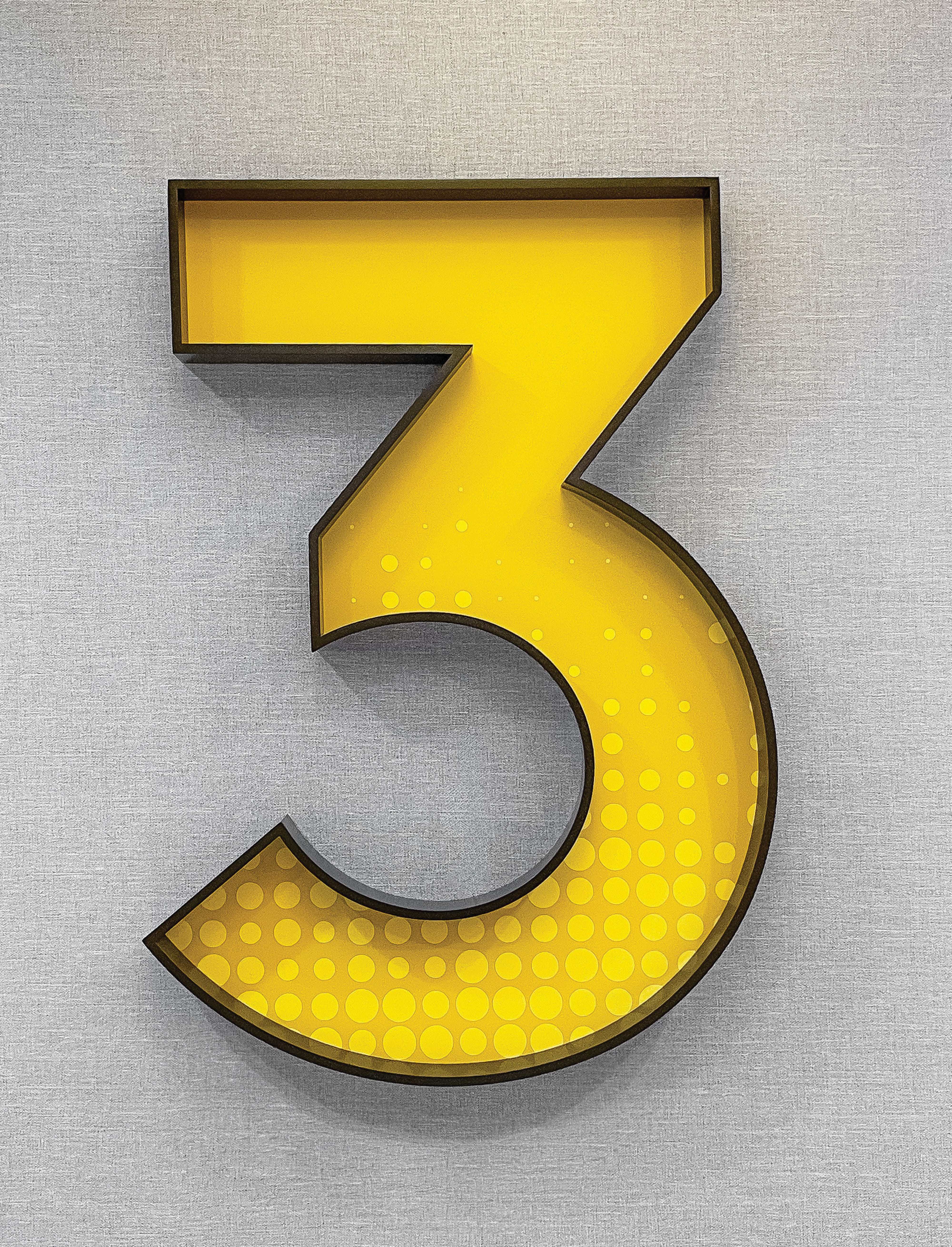 Dimensional “3” floor identification sign with integrated lighting and graphic pattern, showcasing environmental graphic design, signage systems, and intuitive wayfinding for healthcare, workplace, and mixed-use environments.