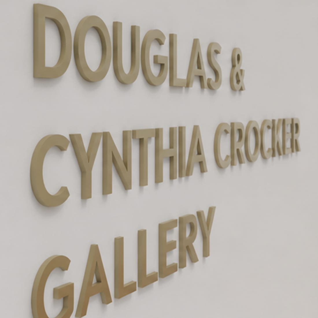 Bronze dimensional lettering reading "Douglas & Cynthia Crocker Gallery" on an interior wall, donor recognition signage by RSM Design