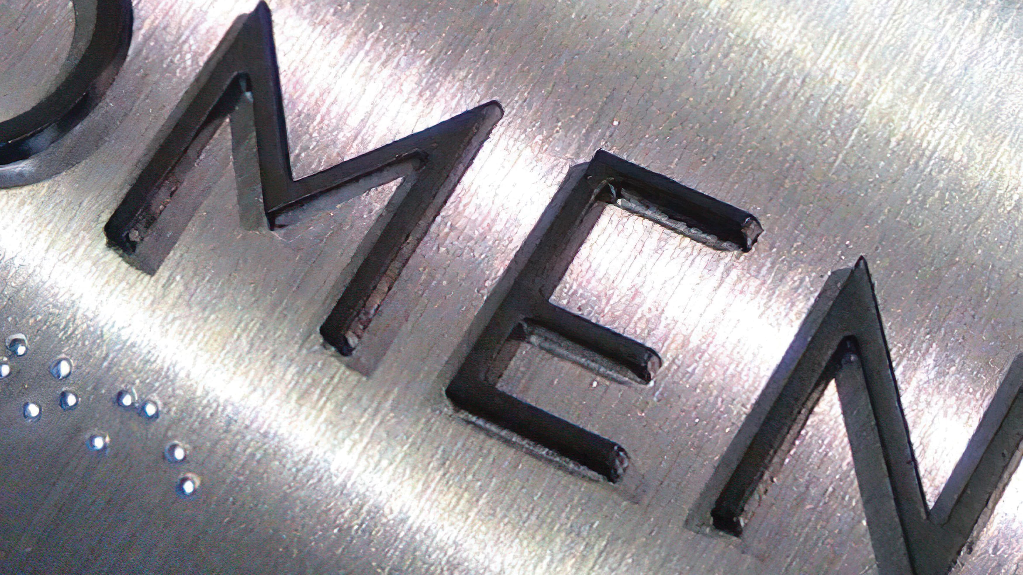 Detail photograph of ADA Compliant tactile signage