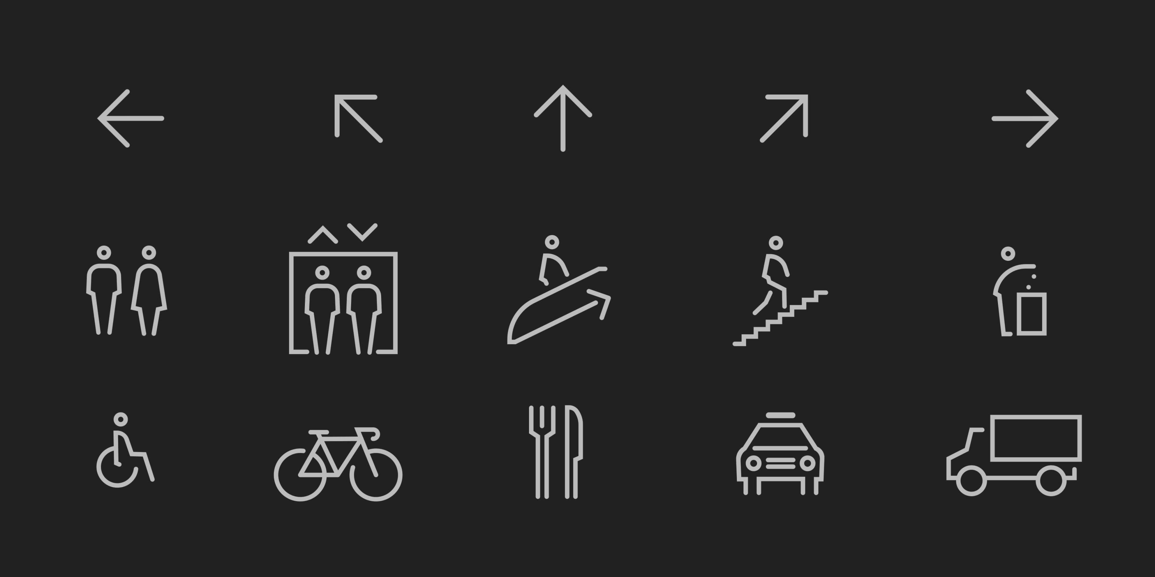 Custom wayfinding icon set for Nashville Yards featuring directional arrows and pictograms for restrooms, elevator, escalator, stairs, accessibility, bicycle, dining, parking, and loading on a dark background, showcasing environmental graphic design and signage system design for a mixed-use workplace development by RSM Design.