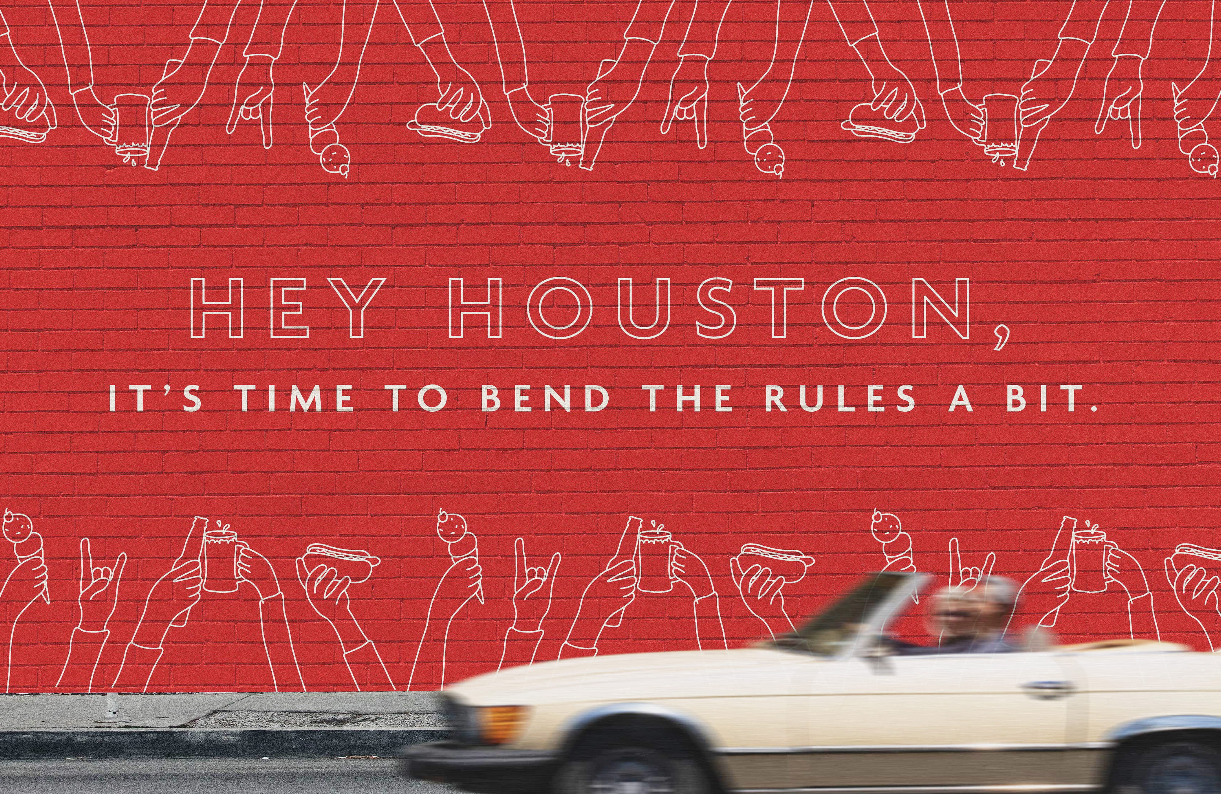 Large-scale branded environmental graphic mural for The Bend HTX featuring bold typography and illustrative graphics on a red brick wall, highlighting brand identity design, placemaking, and experiential graphics for a mixed-use retail and entertainment destination.