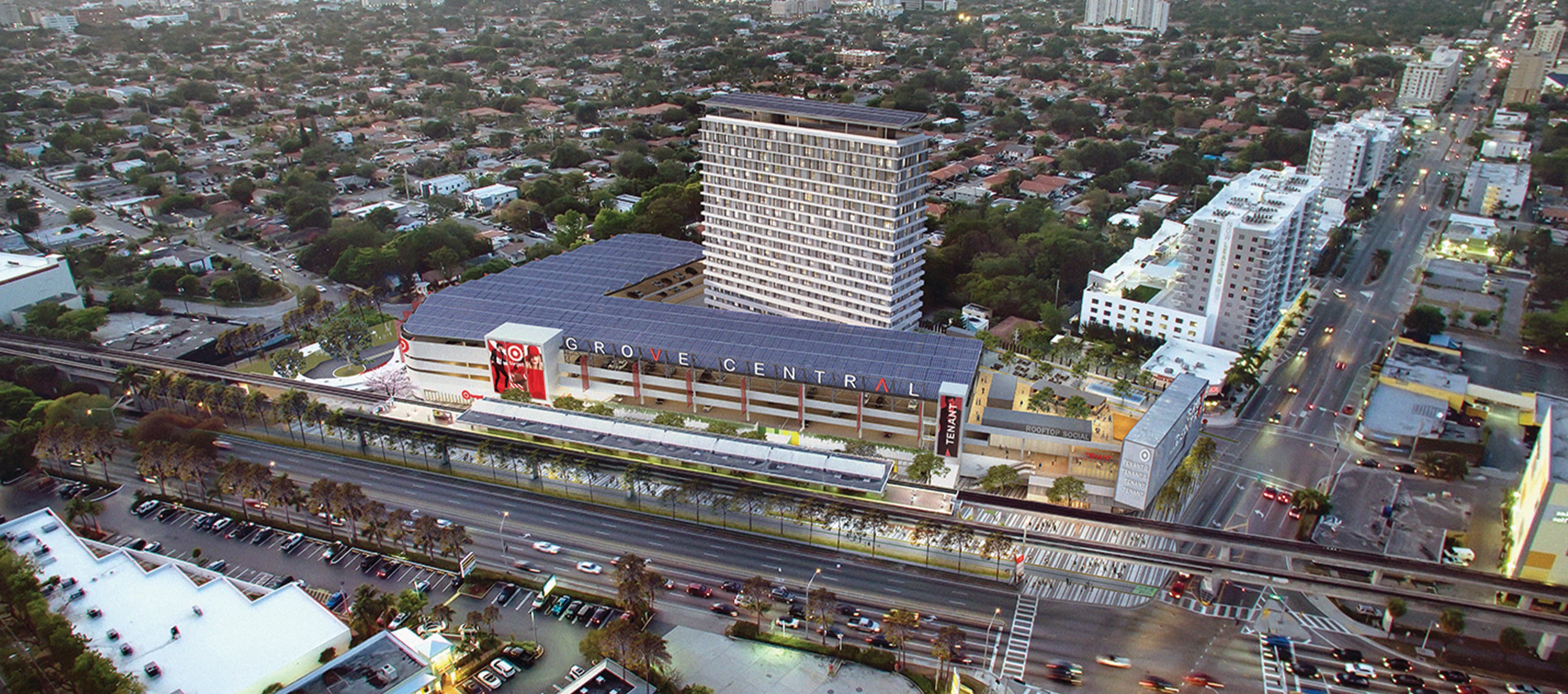 An aerial nighttime rendering of Grove Central, a planned development in Miami, Florida.