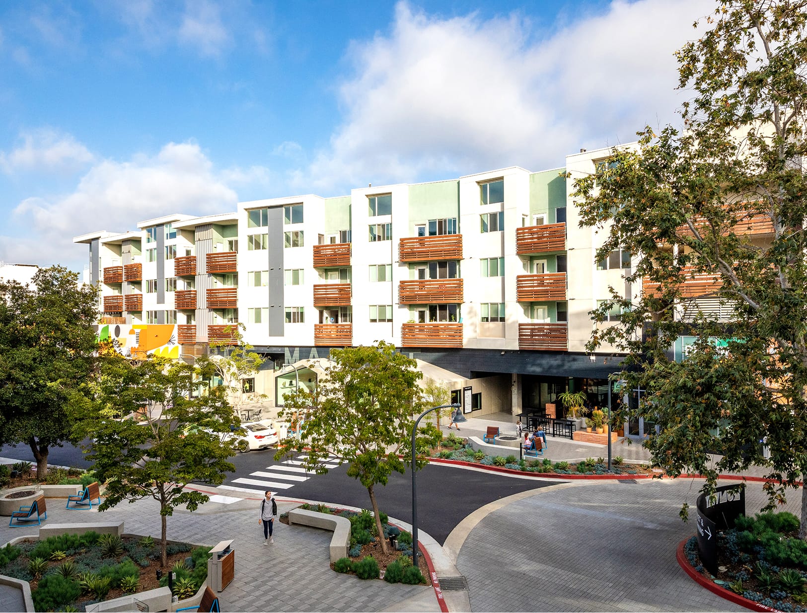 Runway Playa Vista mixed-use district in Los Angeles featuring pedestrian plazas, residential buildings, and retail environments supported by branding, signage, and environmental graphic design by RSM Design.