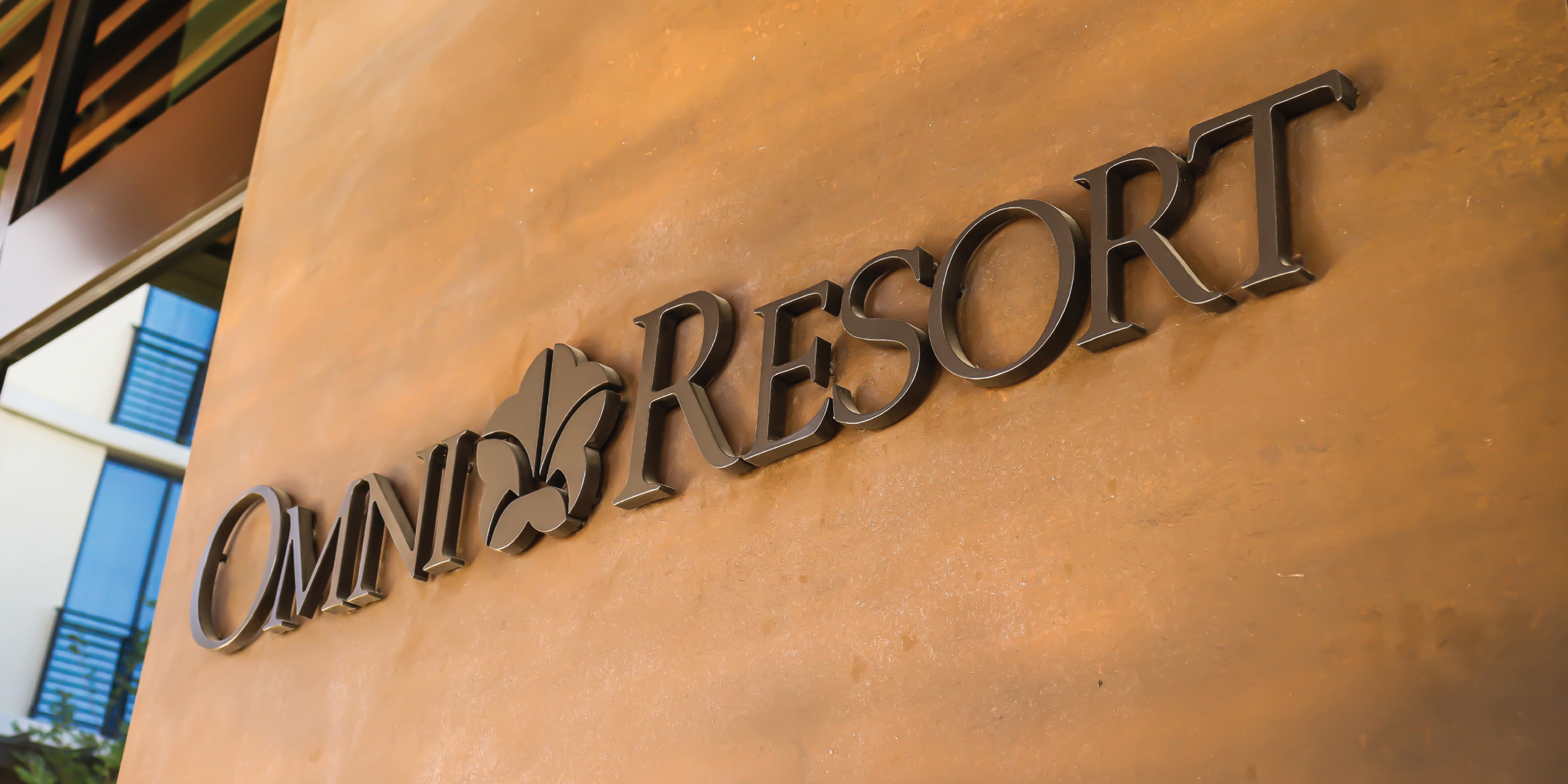 Close up image of the Omni PGA Frisco Resort sign with the Omni Brand. 