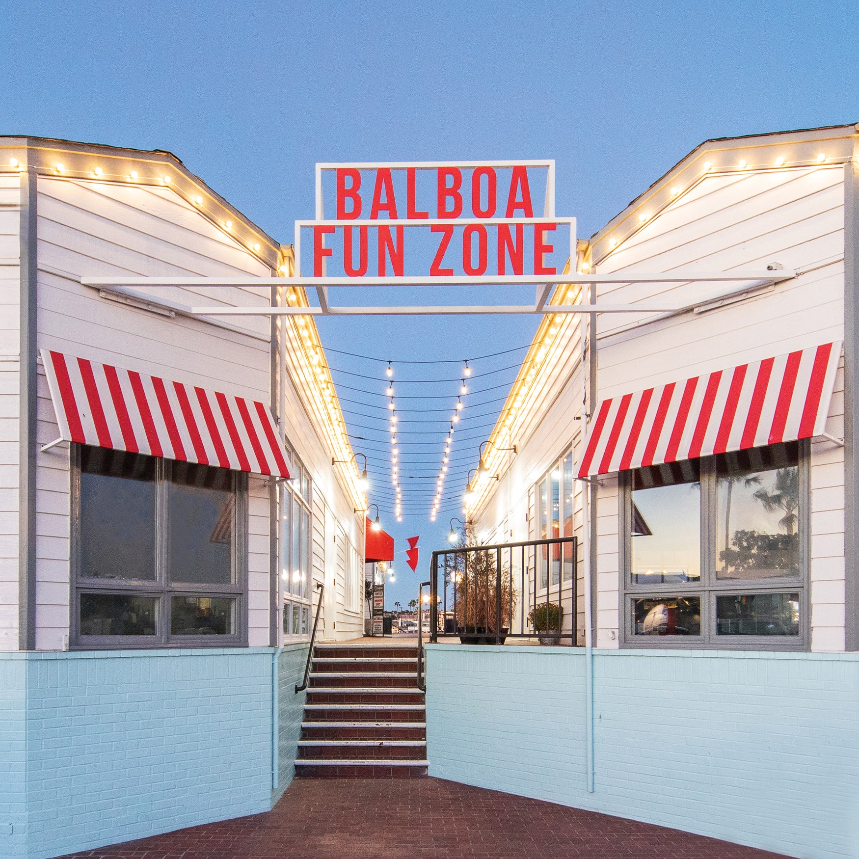 Overhead monument bold red lettering signage for Balboa Fun Zone in Newport Beach, California.