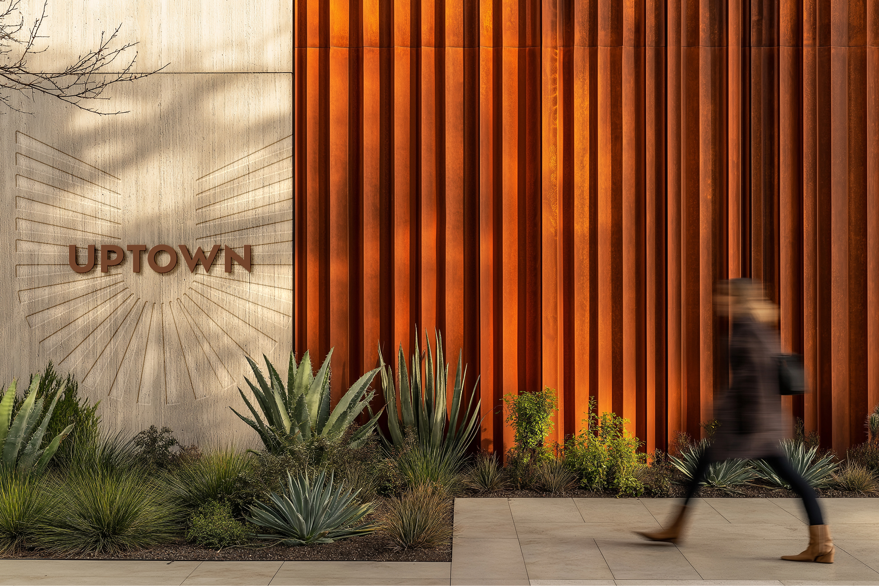 Uptown Tucson dimensional signage on stone facade with corten steel fins and desert landscaping, environmental branding by RSM Design