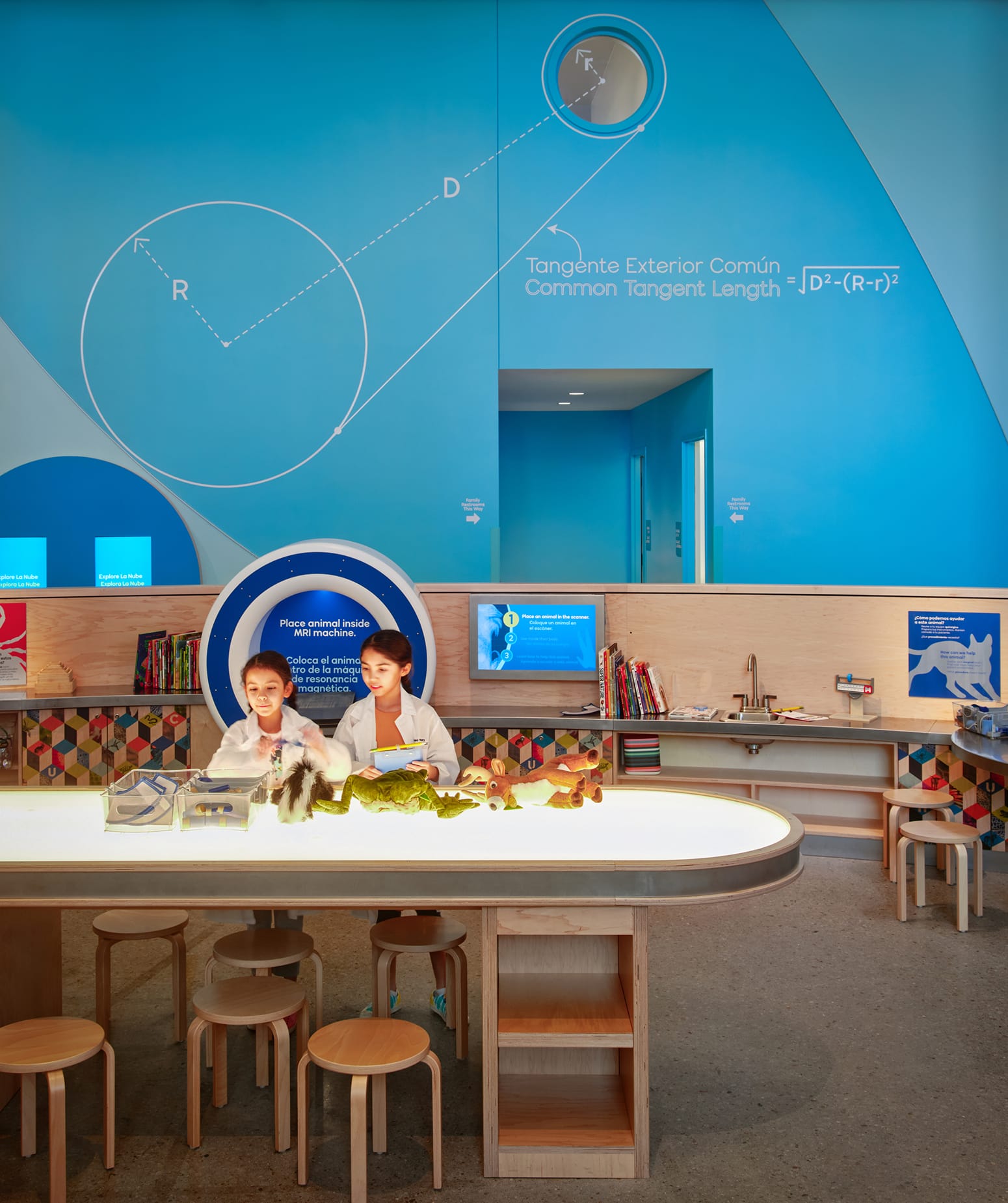 La Nube children's museum interactive exhibit space with bilingual environmental graphics and large-scale mathematical wall illustrations — environmental graphic design by RSM Design