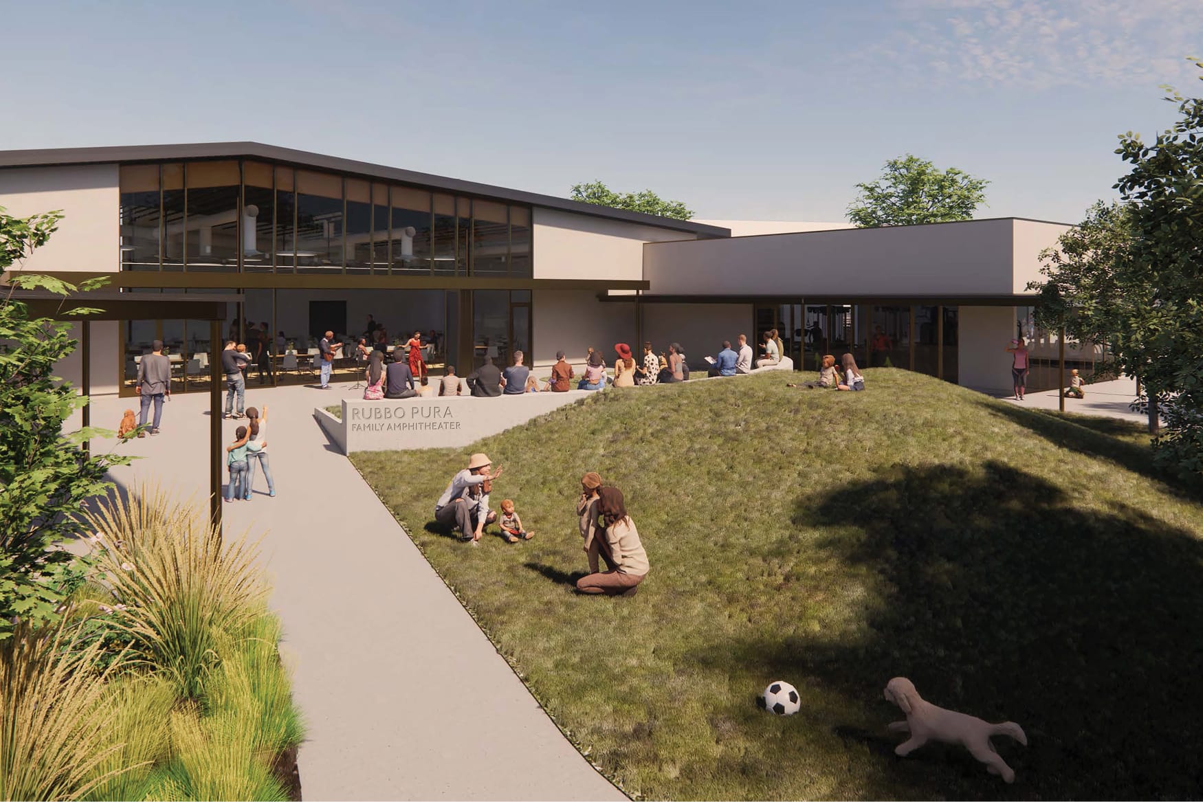 Rendering of the Rubbo Pura Family Amphitheater at the Gonzales Family Community Center, a grassy sloped lawn beside a modern community building, with families relaxing, watching a performance, and playing with a dog on the grass.