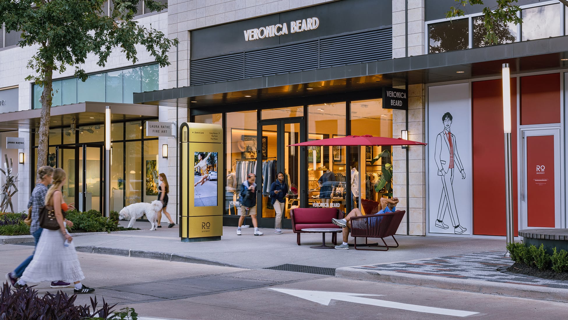 River Oaks District Houston streetscape with Veronica Beard storefront, illustrated wall mural, and interactive digital wayfinding kiosk, retail placemaking and environmental graphic design by RSM Design
