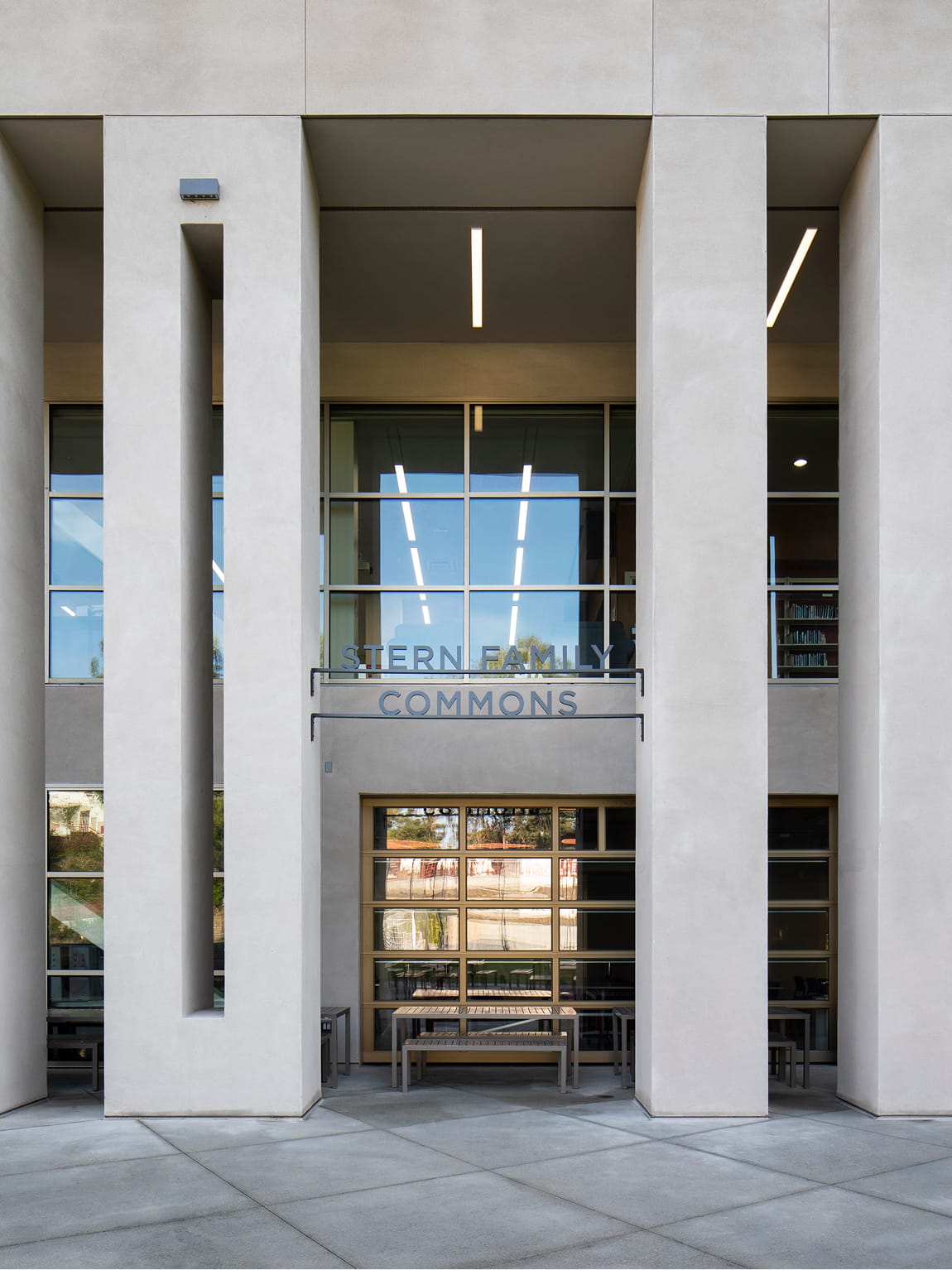 Stern Family Commons entrance sign framed by concrete columns and glass at Brentwood School campus in Los Angeles - donor recognition and identity design by RSM Design