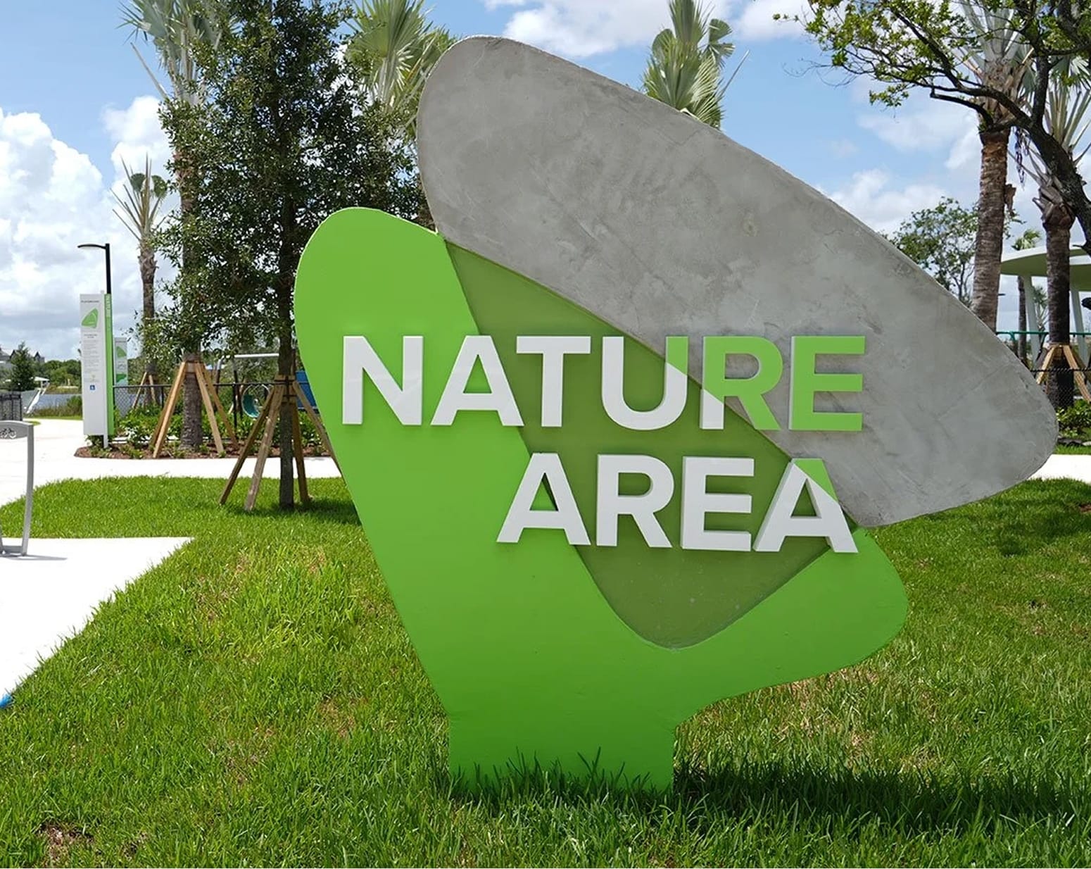 Doral Central Park Nature Area zone marker with sculptural leaf form and dimensional lettering — environmental graphic design by RSM DesignDoral Central Park Nature Area zone marker with sculptural leaf form and dimensional lettering — environmental graphic design by RSM Design