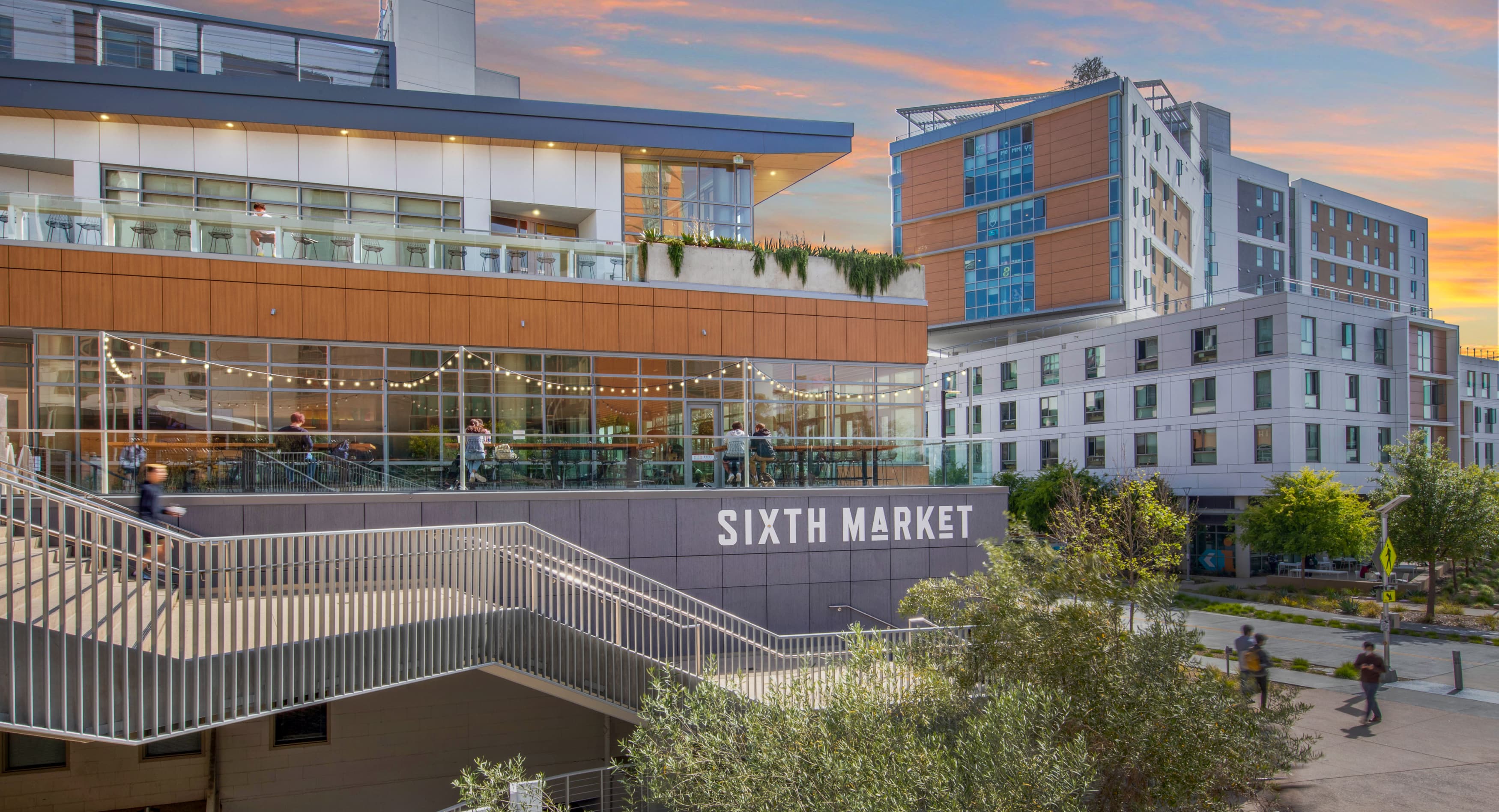 White  "Sixth Market" dimensional project identity signage mounted to wall for UC San Diego by RSM Design in San Diego, California.