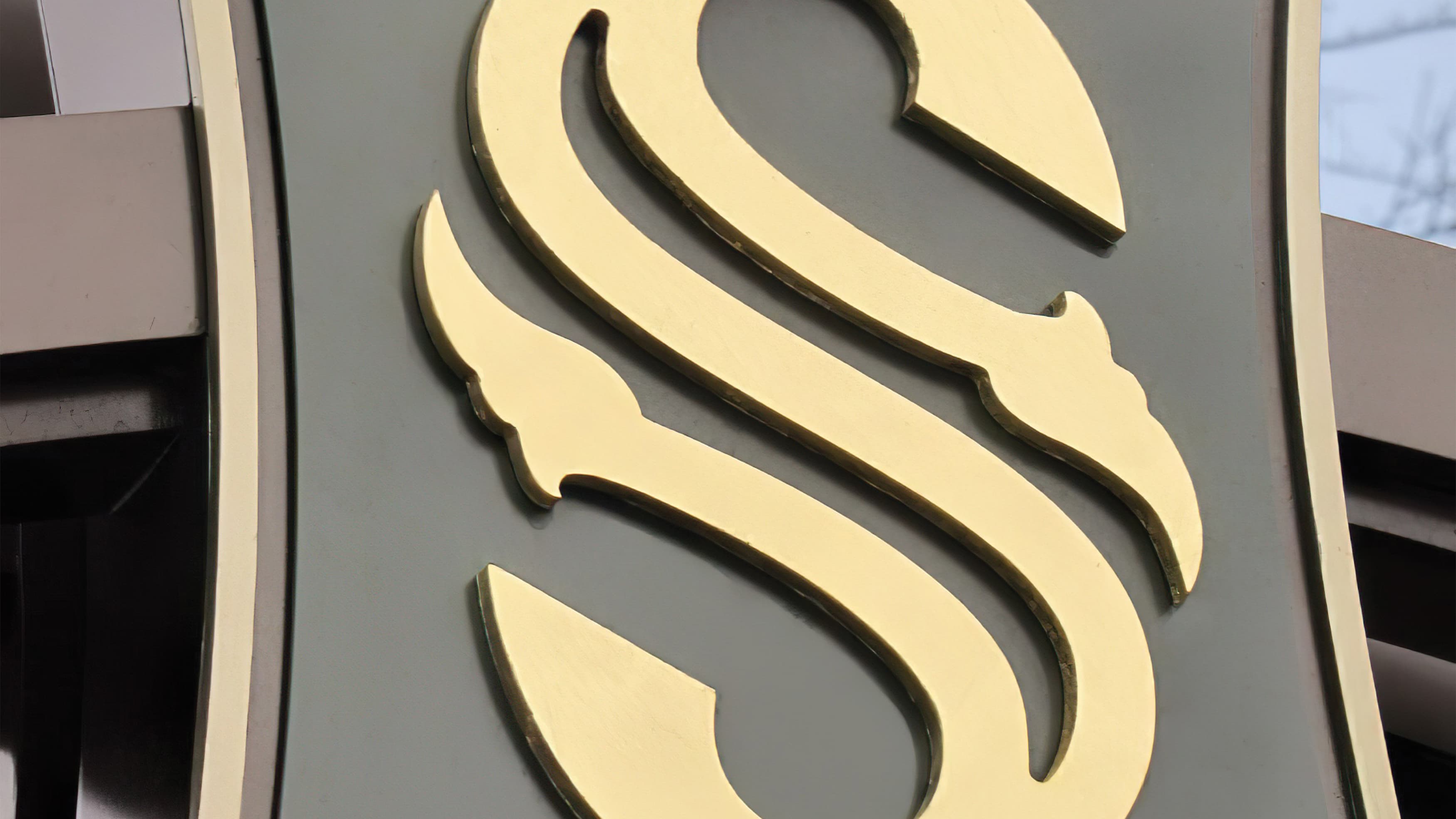 A close-up photo of the S mark of the City of Southlake applied to a sign.