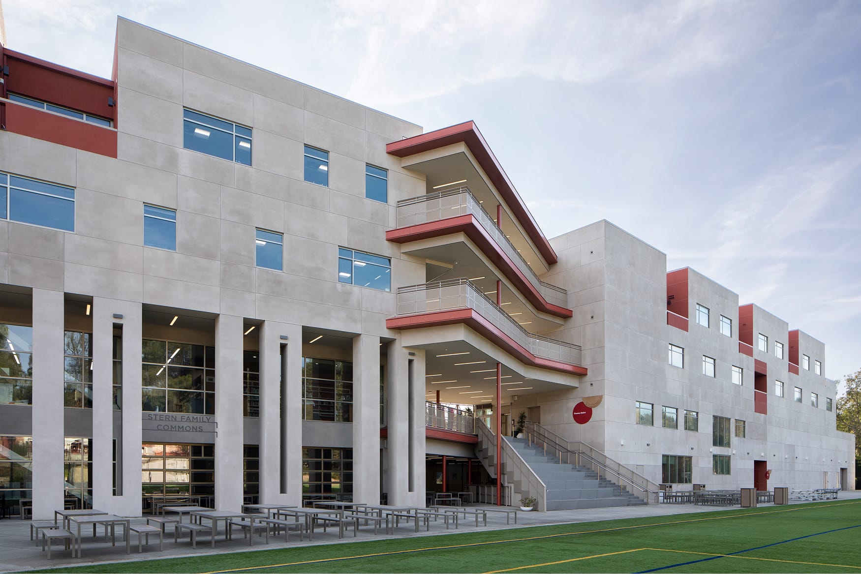 Stern Family Commons exterior with tiered balconies and outdoor courtyard at Brentwood School campus in Los Angeles - donor recognition and environmental graphic design by RSM Design