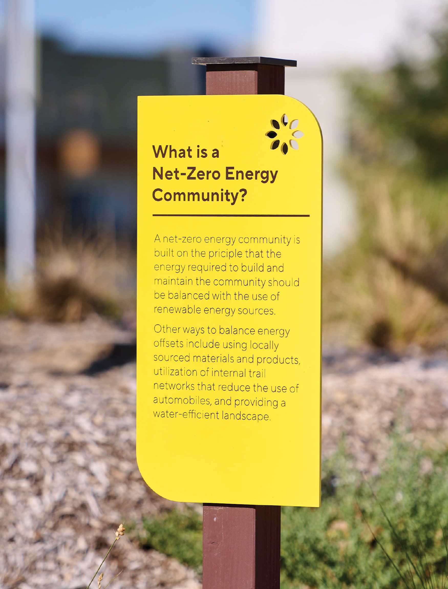 Bright yellow signage indicated a net zero energy community designed by RSM Design for Valencia. 
