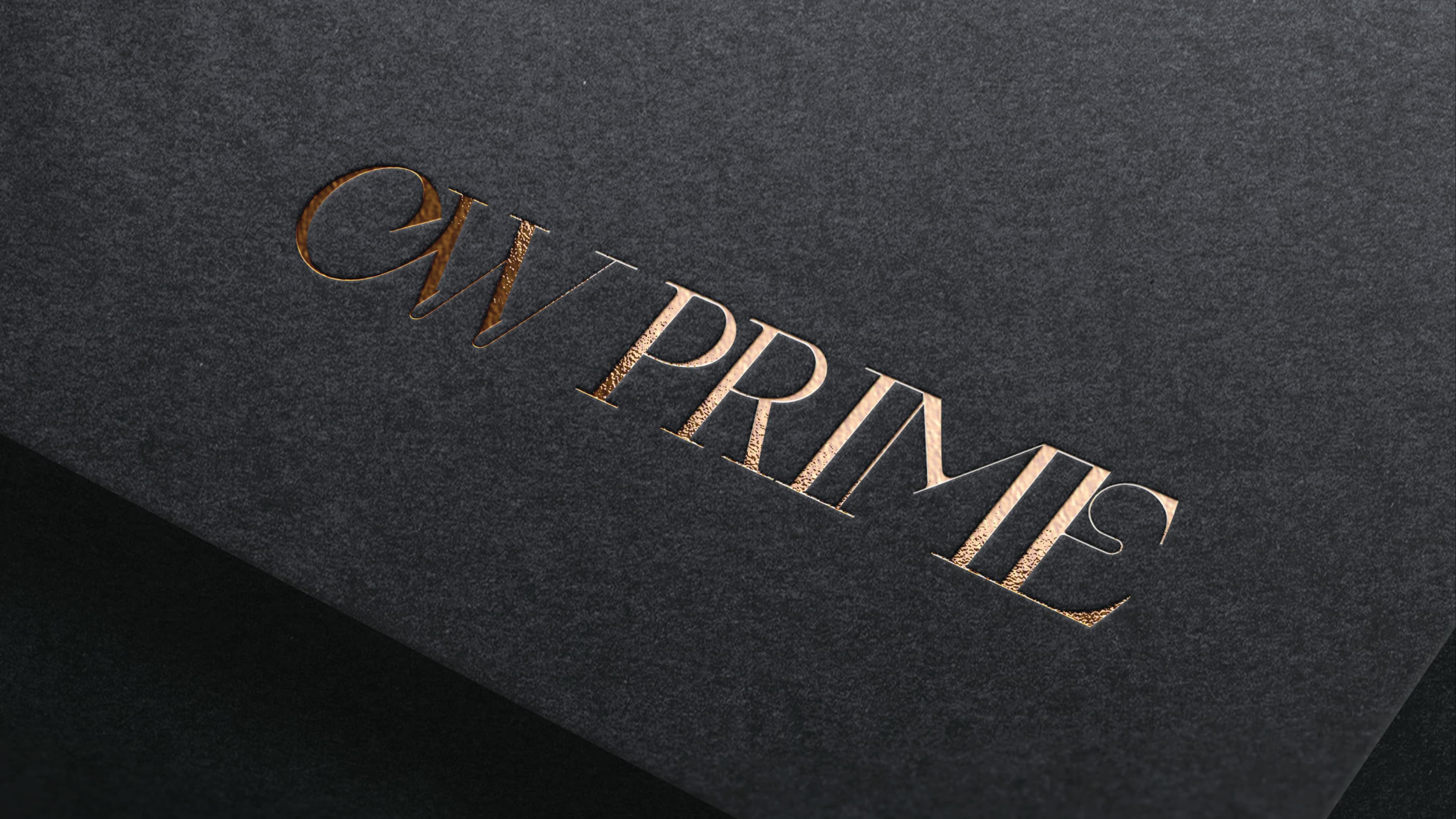 Gold foil embossed CW Prime logo on charcoal black textured print collateral — RSM Design branding and visual identity, print and digital collateral, and specialty graphics for hospitality and food and beverage destinations.